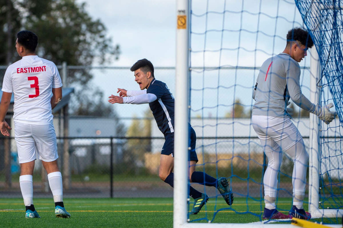 Bellarmine Prep’s Peter Radovich celebrates after scoring the go-ahead goal as Eastmont’s Mark Gomez and goal keeper Armando Mendoza look on during the second half of a 4A State tournament first-round game on Wednesday, May 18, 2022, at Bellarmine Prep High School in Tacoma, Wash.