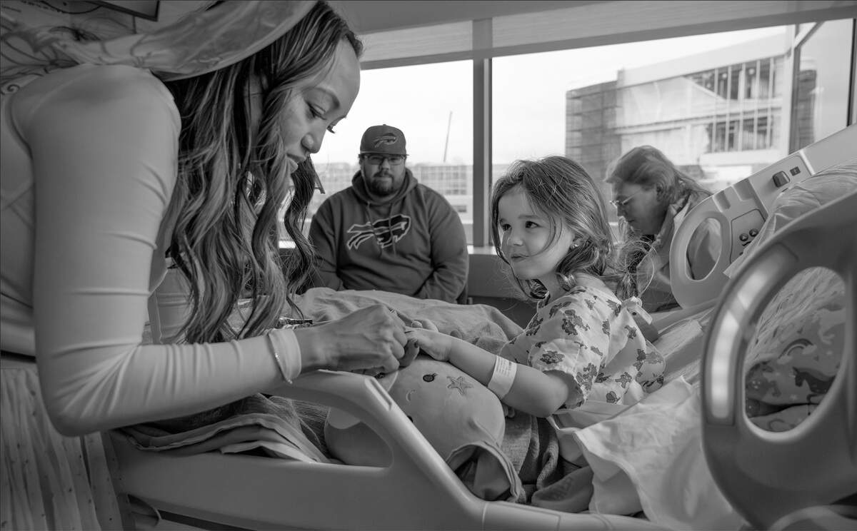 Martina “The Nail Fairy” Ngo paints the fingernails of patient Madison Harrold, 4, of Bremerton, at Mary Bridge Children’s Hospital in Tacoma, Washington, on Wednesday, Nov. 20, 2024.