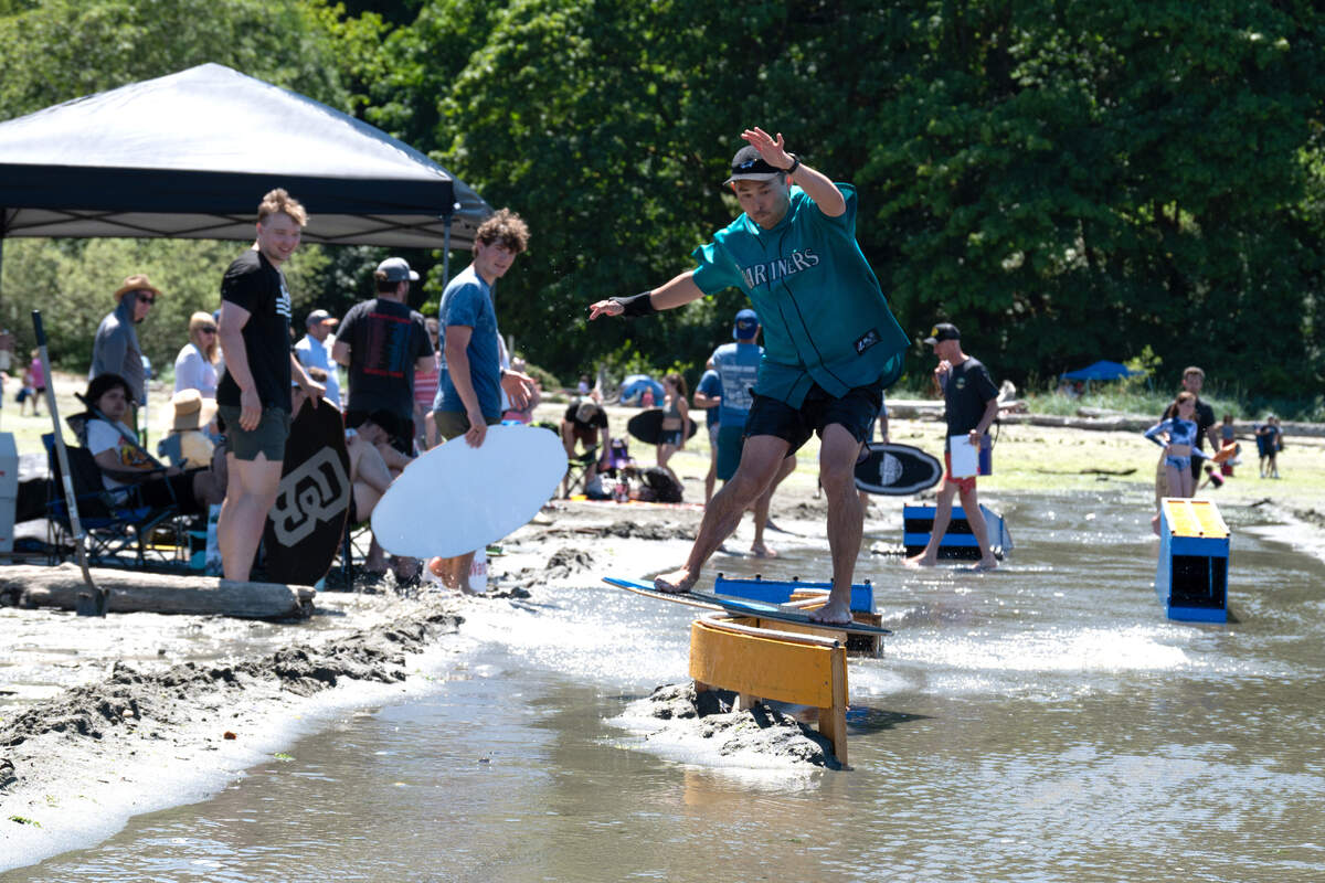 Local skimboarder Isaac Thomas navigates Beachfest’s low tide terrain park.