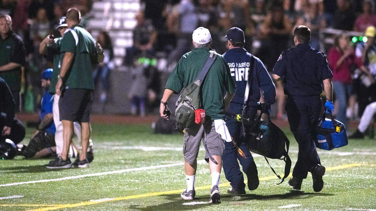 Paramedics arrive on the field at 8:00 during Friday night’s Fish Bowl crosstown rivalry football game at Roy Anderson Field in Purdy, Washington, on Sept. 15, 2023. Gig Harbor won the game, 21-20.