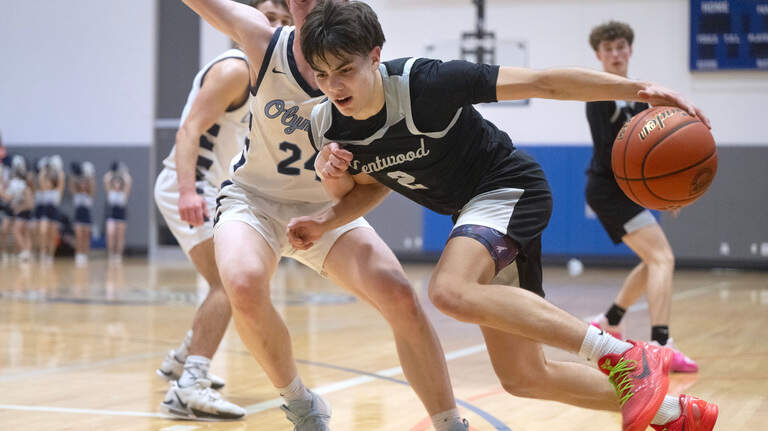 PHOTOS: Kentwood holds off Olympia in overtime, 51-42
