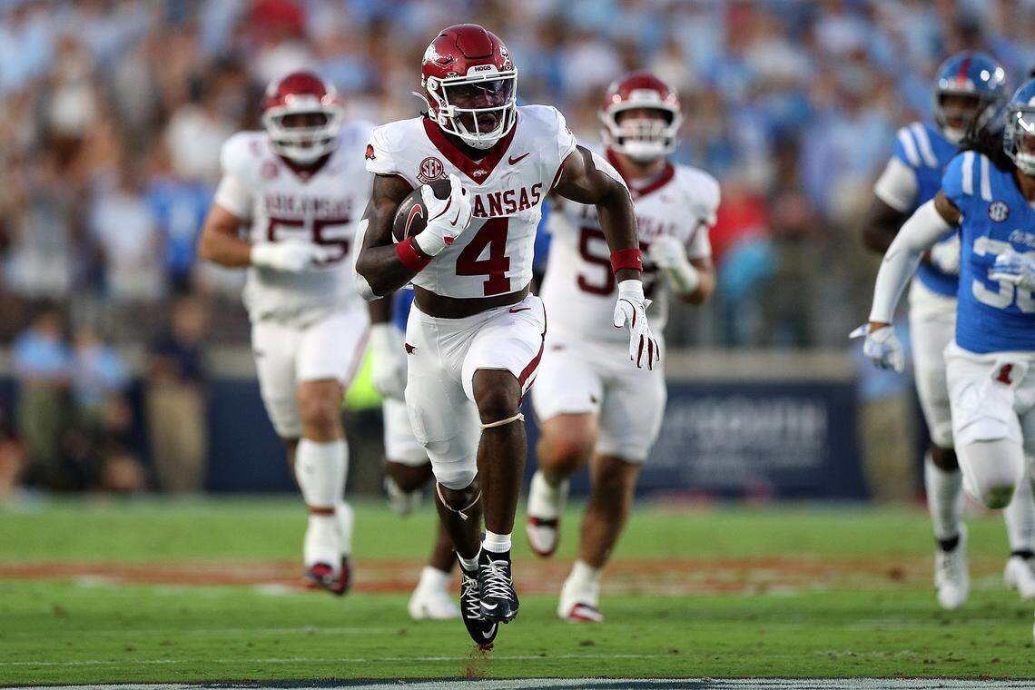 OXFORD, MISSISSIPPI - SEPTEMBER 13: Mike Washington Jr. #4 of the Arkansas Razorbacks carries the ball during the first half against the Mississippi Rebels at Vaught-Hemingway Stadium on September 13, 2025 in Oxford, Mississippi. (Photo by Justin Ford/Getty Images)