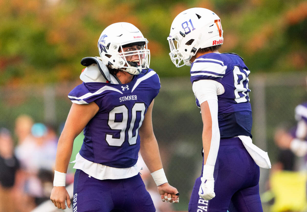 Sumner’s Ashton Pillard (81) and Shawn Griffith (90) react to a defensive stop against Lake Stevens during the first half of the game at Sumner High School, on Friday, Sept. 6, 2024, in Sumner.