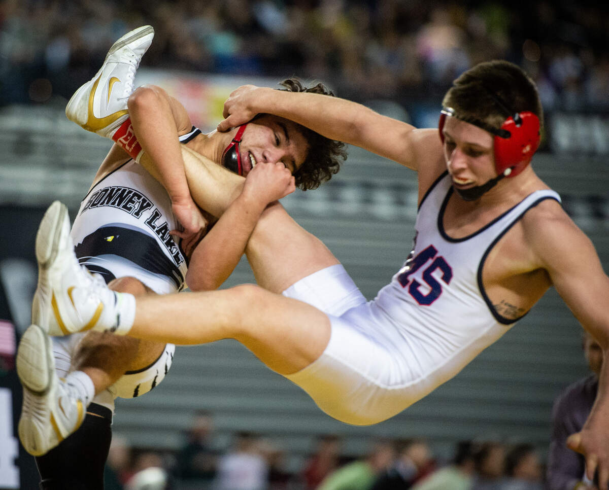 Bonney Lake’s Yusief Lillie throws Mount Spokane’s Jarret Sharp during the 3A 113lb title match at Mat Classic XXXI at the Tacoma Dome in Tacoma, Wash., on Saturday, Feb. 16, 2019.