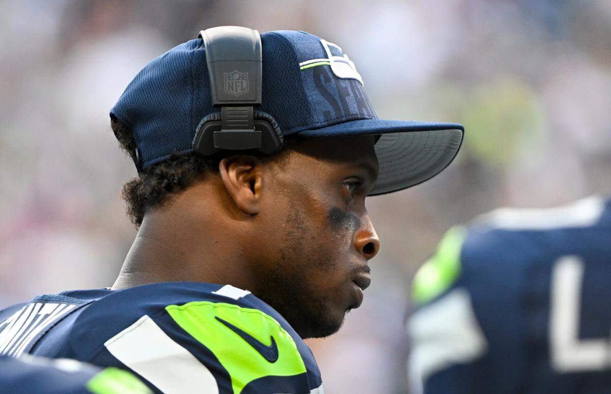 Seattle Seahawks quarterback Geno Smith (7) looks on from the sidelines during the second quarter of the preseason game against the Minnesota Vikings at Lumen Field, Thursday, Aug. 10, 2023, in Seattle, Wash.