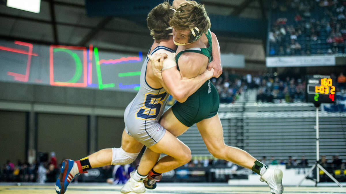 Southridge’s Mikael Failor grapples with Peninsula’s Isaac Casey during Mat Classic XXXI at the Tacoma Dome in Tacoma, Wash., on Saturday, Feb. 16, 2019.