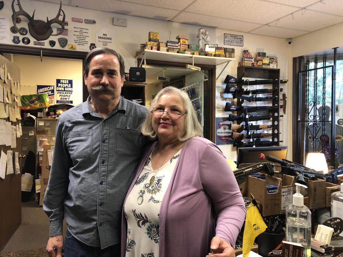 Dan and Mary Davies stand inside their business, Mary’s Pistols, at 4040 S Tyler St. in Tacoma. The Davies’ say Tacoma’s proposed firearm and ammunition tax will cause their 15-year shop to go out of business. Oct. 24, 2019