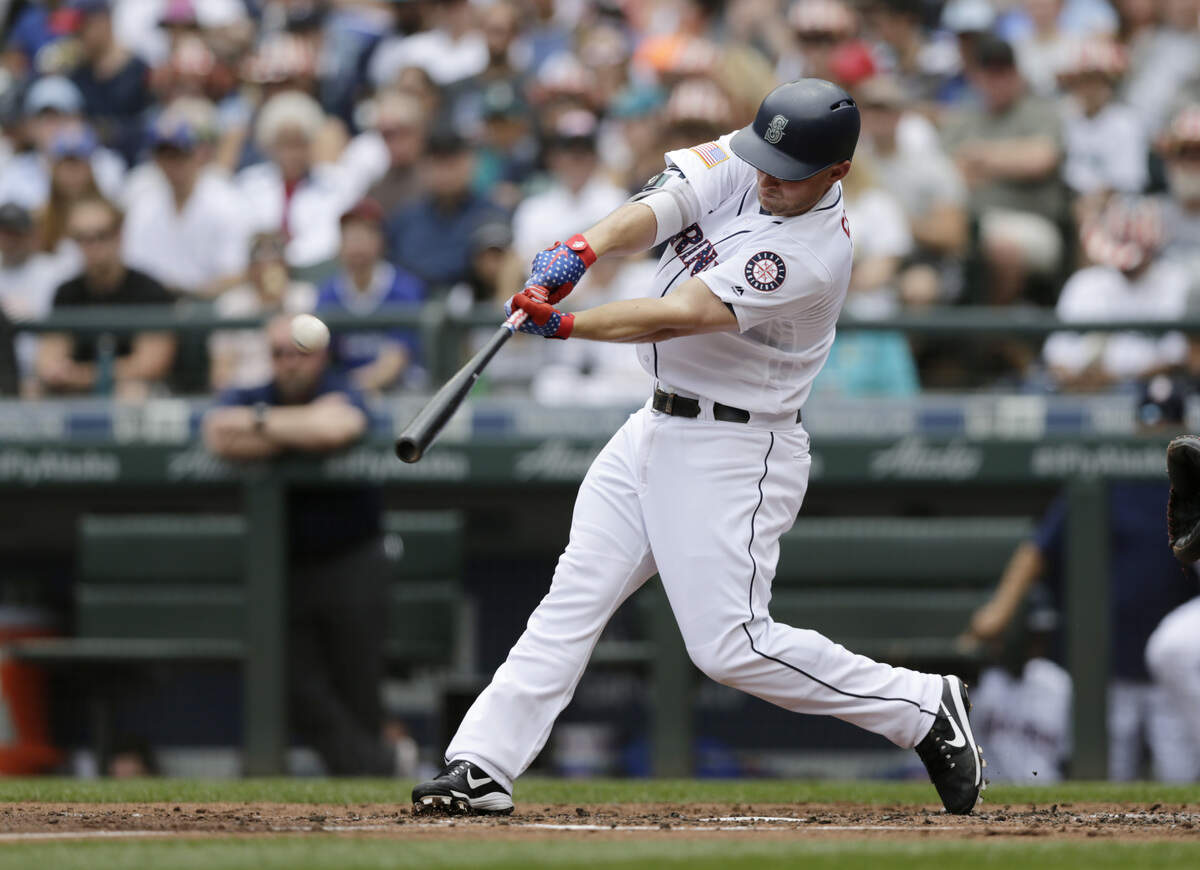 Seattle Mariners' Kyle Seager hits a solo home run on a pitch from Los Angeles Angels starting pitcher Garrett Richards during the second inning of a baseball game, Wednesday, July 4, 2018, in Seattle. (AP Photo/John Froschauer)