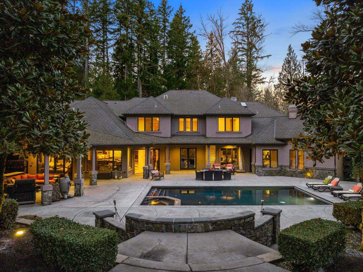 Sitting on over 10 acres, the Woodinville, WA home is designed for ultimate entertaining: the kitchen boasts dual islands, while the theater, game room with full bar and aquarium elevate gatherings.