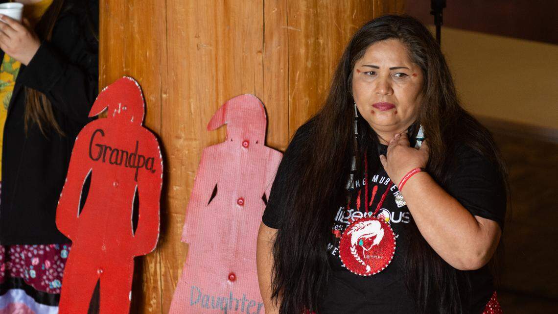 Roxanne White, founder of the survivor-led grassroots organization Missing and Murdered Indigenous Women, People and Families, listens to an honor song from The West Shore Canoe Family and Tulalip youth at the National Day for Awareness and Healing for Missing and Murdered Indigenous Women, People and Families Saturday, May 7, 2022, at Daybreak Star Indian Cultural Center in Seattle, Wash.