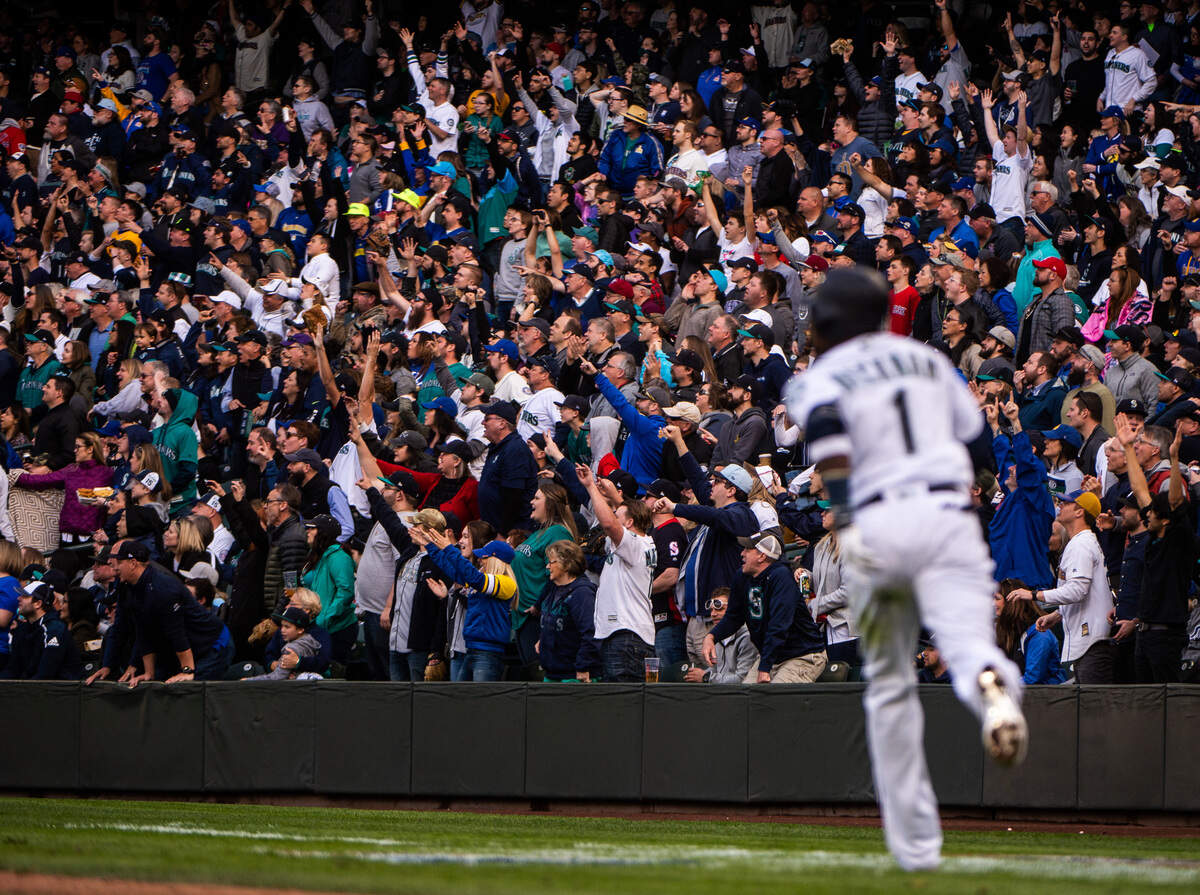 The crowd cheers as Mariners’ shortstop Tim Beckham hits his second home run of the game in the third inning. The Seattle Mariners played the Boston Red Sox in a Major League Baseball game at T-Mobile Park in Seattle, Wash., on Thursday, March 28, 2019.