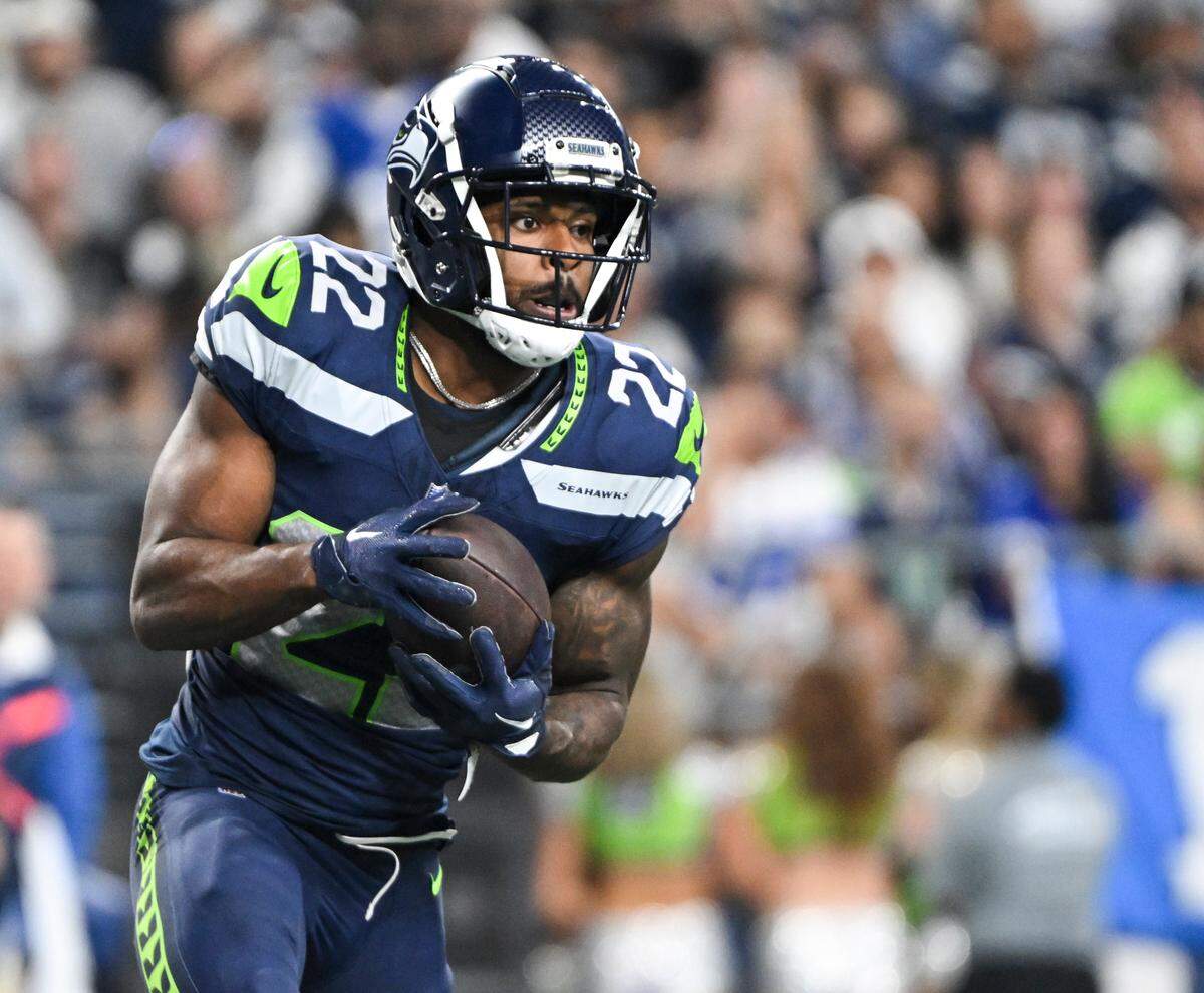 Seattle Seahawks cornerback Tre Brown (22) intercepts the ball in Dallas’s end zone during the third quarter of the preseason game at Lumen Field, Saturday, Aug. 19, 2023, in Seattle, Wash.