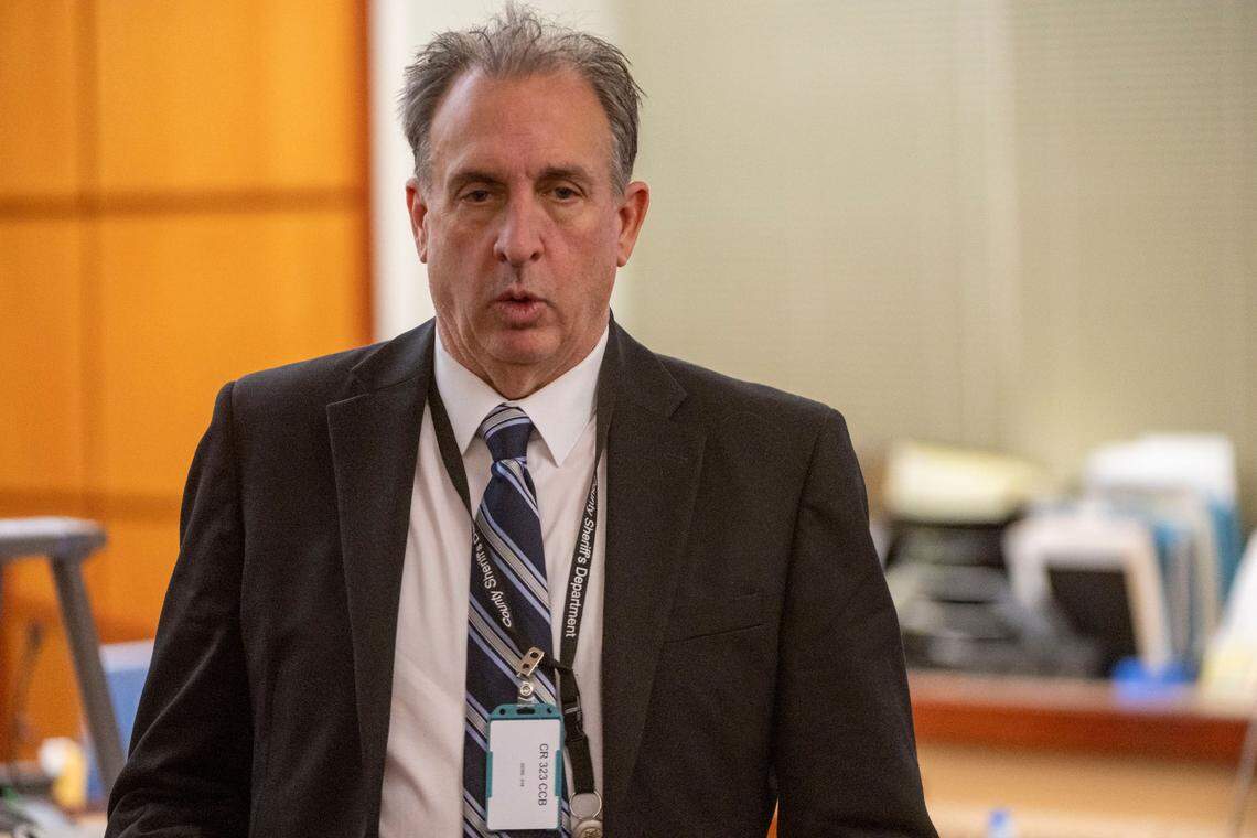 Pierce County Sheriff Ed Troyer leaves the court room during the morning recess on Thursday, Dec. 8, 2022, in Pierce County District Court in Tacoma, Wash.