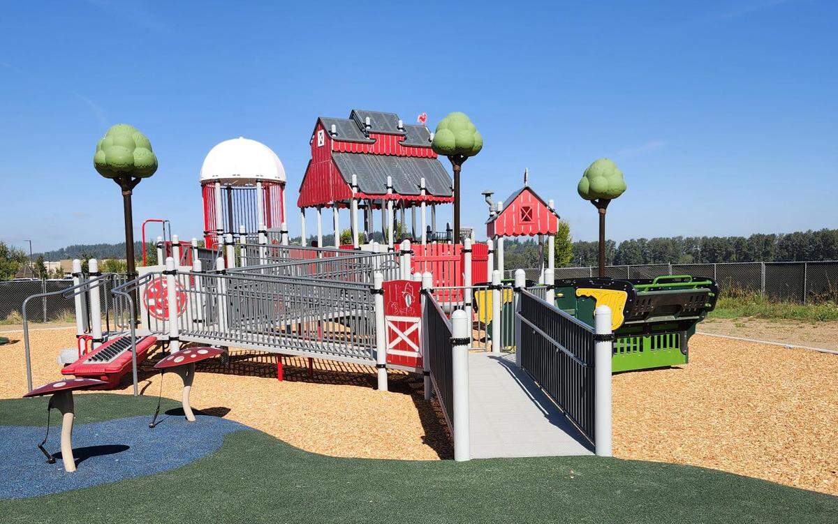 An image of Van Lierop Playground, a new barn-themed play area for children between 2 and 12 years old. The playground is at Van Lierop Park, between two parking lots at 3401 Eighth Ave. SE. The playground includes slides, musical amenities and boulders to climb, and it is scheduled to open to the public on Oct. 30, 2025.