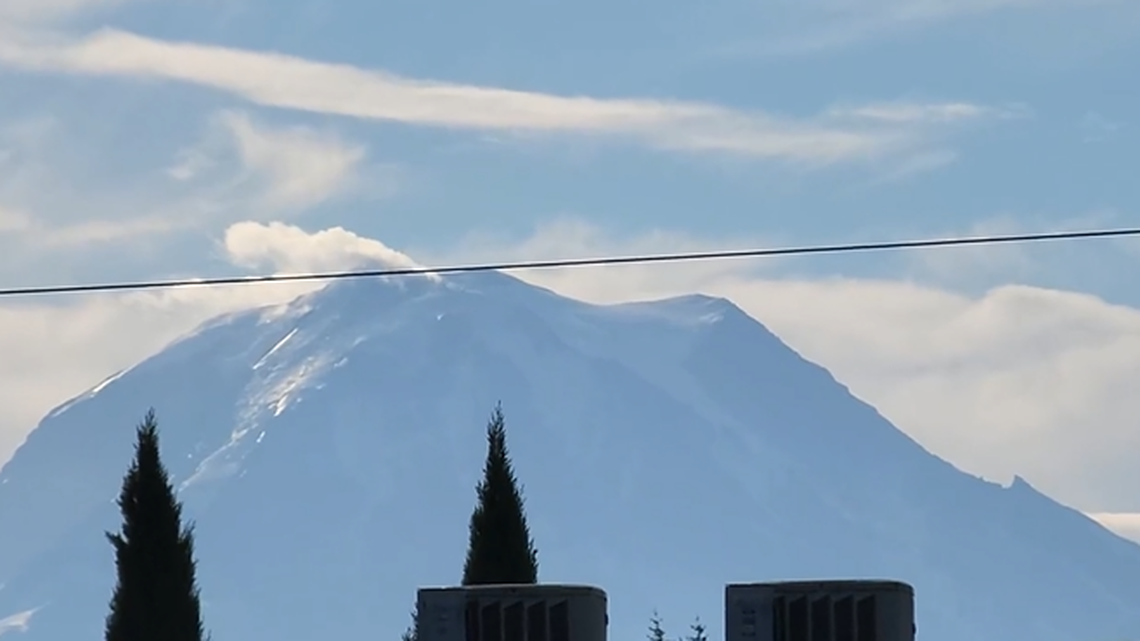 A video of Mount Rainier shows a lenticular cloud hovering over it on Sept. 7, 2022. People on social media initially thought it was a sign of volcanic activity.