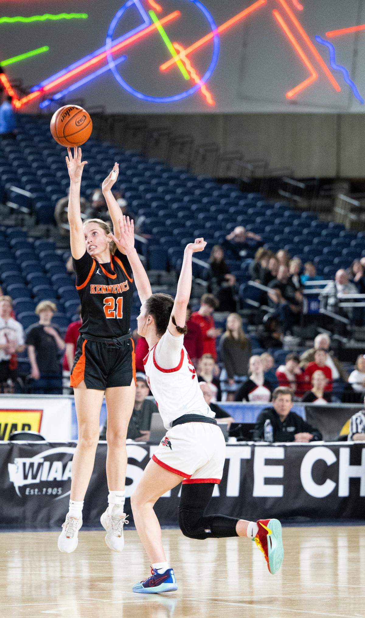 Kennewick’s Ashlyn Dress (21) drains a three-point basket against Snohomish during the first round of the Class 3A state tournament game at the Tacoma Dome, on Wednesday, Feb. 28, 2024, in Tacoma, Wash.
