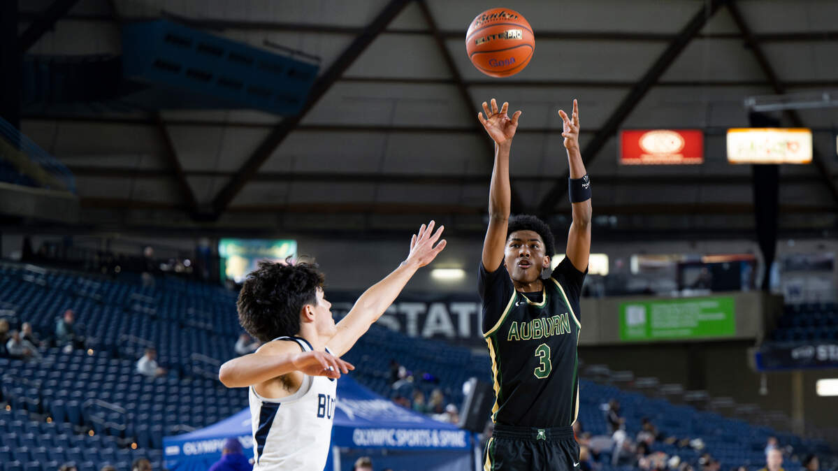 Auburn’s Daniel Johnson (3) shoots the ball against Gonzaga Prep during the first half of a Class 4A state basketball tournament quarterfinal game at the Tacoma Dome on Thursday, March 6, 2025, in Tacoma, Wash.