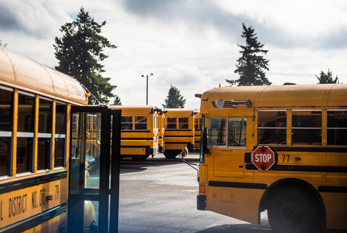 Buses are shown parked at the Tacoma School District Bus Center in Tacoma, Wash., on Tuesday, Oct. 30, 2018. Twenty-four bus drivers contracted to transport special-needs students called out sick Monday morning, with 26 calling out sick Tuesday morning. Parents were notified via automated calls.