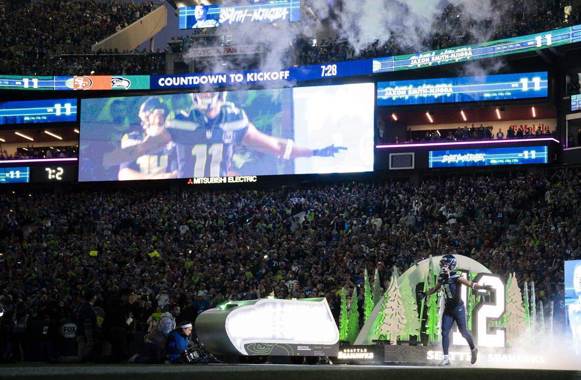 Seattle Seahawks wide receiver Jaxon Smith-Njigba (11) runs out before the NFC Divisional Round game against the San Francisco 49ers at Lumen Field, on Saturday, Jan. 17, 2026, in Seattle.