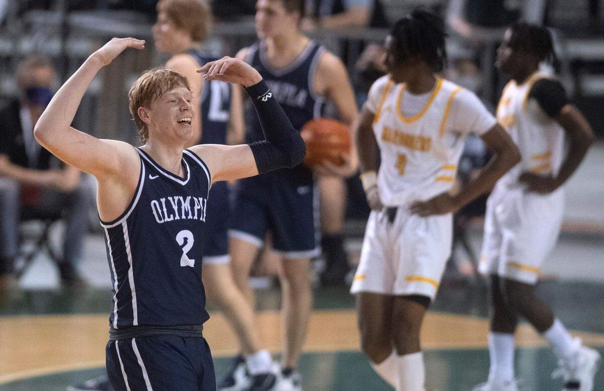 Olympia’s Andreas Engholm fires up the fans late in Wednesday afternoon’s opening-round game of the WIAA 4A Boys Basketball State Championships tournament in the Tacoma Dome in Tacoma, Washington, on Wednesday, March 2, 2022. Olympia defeated the Mariner Marauders, 50-41.