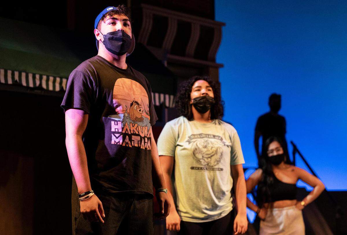 Nick Marston, 17, a junior at Silas High School, left, and Jordan Talley, 15, a sophomore at Fife High School, center, rehearse their roles for “In the Heights” at the Tacoma Musical Playhouse in Tacoma, Wash. on Thursday, May 5, 2022. Marston and Talley also performed at the Apollo Theatre in New York for the Next Narrative competition’s finals after winning the semi-finals in Seattle.