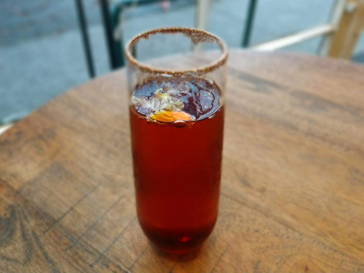 The Klimt cocktail is flavored with blackberry syrup and comes with a gold-dusted rim.