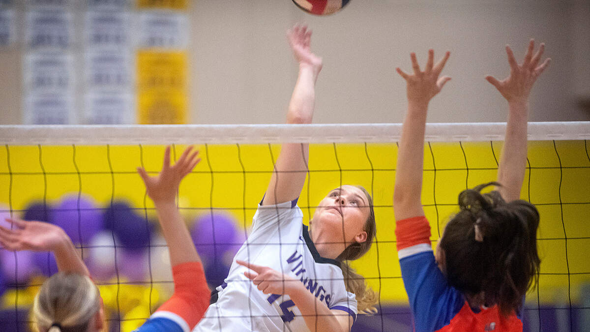Puyallup senior outside hitter Ivy Vindivich fires a shot past Graham-Kapowsin defenders Jessica Wilkins (left) and Noelle White during their regular season finale volleyball match at Puyallup High School in Puyallup, Washington, on Tuesday, Oct. 25, 2022. After dropping the first two games, 22-25 and 21-25, Puyallup rebounded to sweep the final three games, 25-22, 25-19 and 15-13, for the best of five victory.