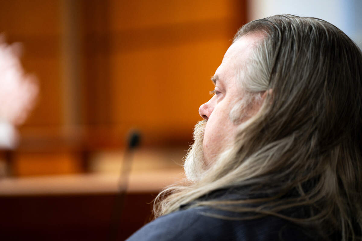 Defense attorney Travis Currie looks on as prosecutor Sunni Ko gives an opening state in the jury trial of Maleke Pate for four counts of aggravated murder, at Pierce County Superior Court, on Tuesday, March 5, 2024, in Tacoma, Wash. Pate is accused of fatally shooing four people in Tacoma’s Salishan neighborhood on Oct. 21, 2021.