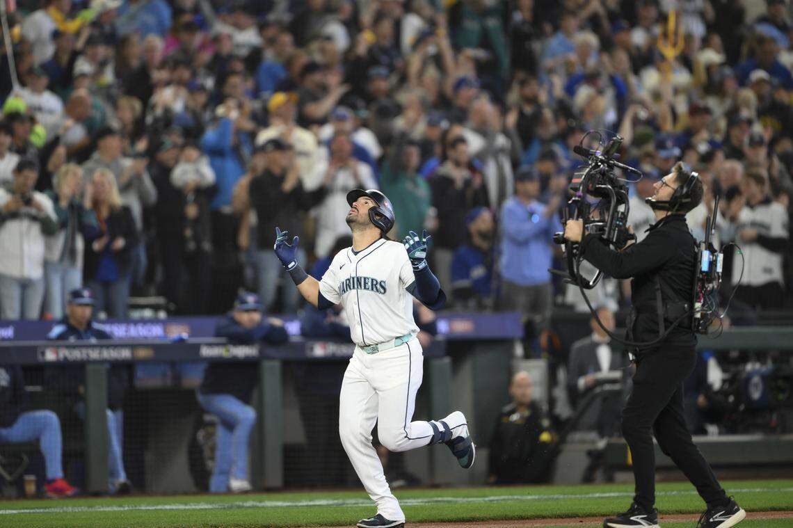 Seattle’s Eugenio Suarez celebrates after hitting a solo home run in the second inning of the American League Championship Series on Friday, Oct. 17, 2025 at T-Mobile Park in Seattle.
