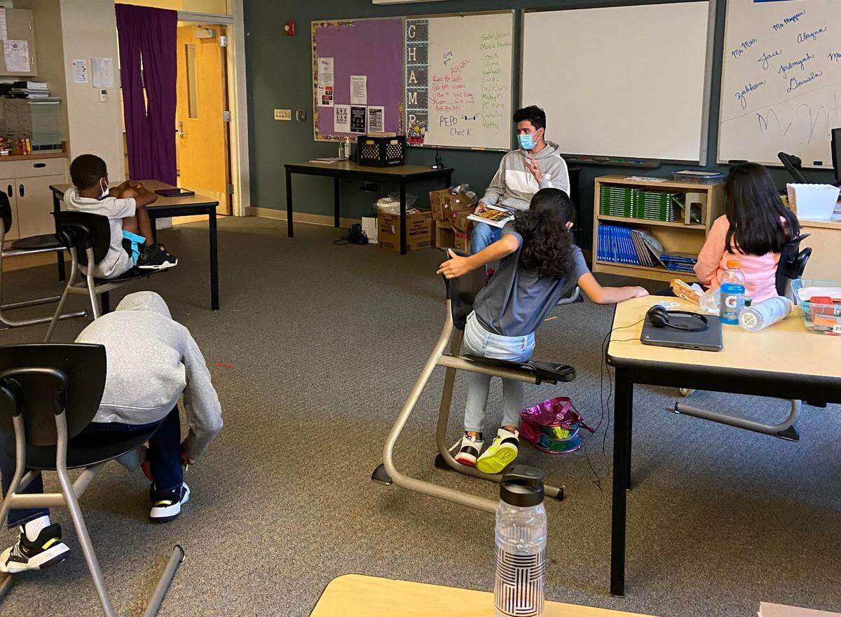 Bryan Jandres, a senior at Lincoln High School, reads to students in his diverse books book club.