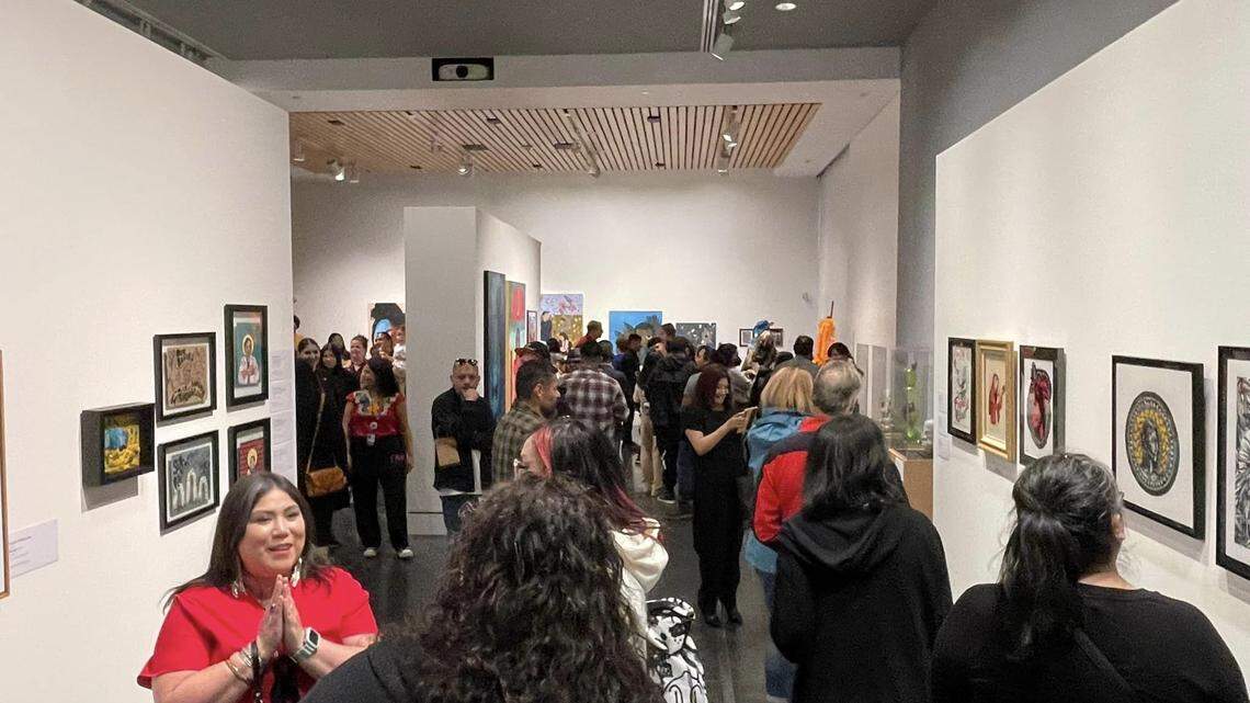 Guests walk through the “El Noroeste” exhibit at the Tacoma Art Museum during the opening reception on Sept. 23.