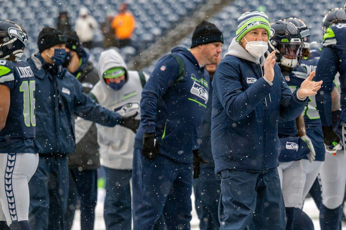 Seattle Seahawks head coach Pete Carroll welcomes players onto the field prior to the start of an NFL game against the Chicago Bears on Sunday afternoon at Lumen Field in Seattle.