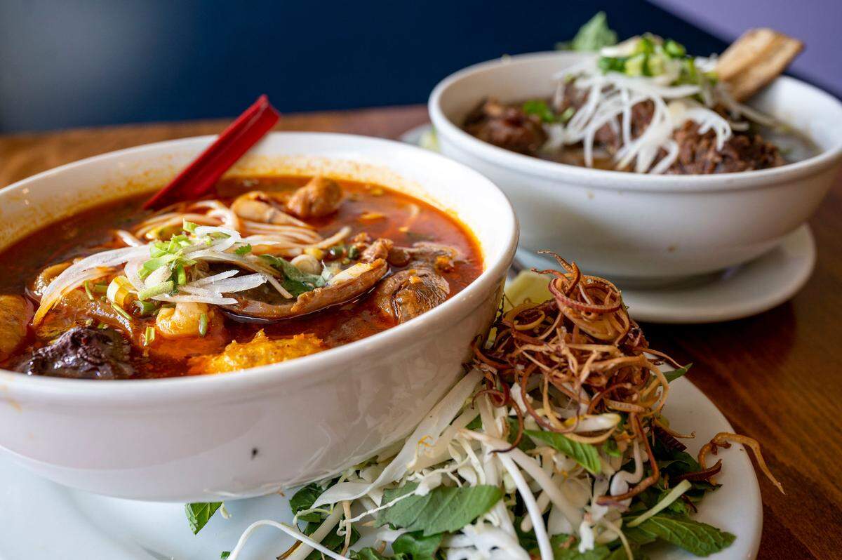 Lunar’s Pho serves a great rendition of bún bò Hue (front), a spicy noodle soup from Central Vietnam, as well as wonderful pho.