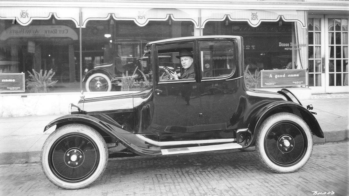 Marvin D. Boland Collection Series: BOLAND-B5324 (Unique: 38674) Date: 02-11-1922 Description: A new Dodge coupe, with Tacoma businessman H.J. Salmela at the wheel, is parked on the brick roadway outside the Griffith Motor Co., 728-30 Broadway, on February 11, 1922. Griffith Motors was the authorized dealer for Dodge Brothers motor cars. A new car was still a relative rarity back in the early 20s and local newspapers often ran photographs of happy customers with their new purchases. Mr. Salmela was already the owner of three six-cylinder cars but chose the Dodge coupe for a practical purpose, as best suited for a motor trip to San Diego and a tour of the entire state of California.
