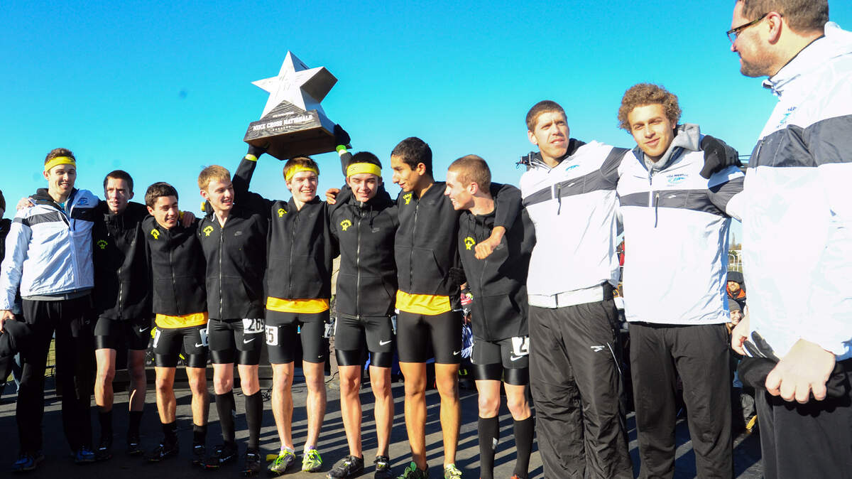 The Gig Harbor Tides hoisted the first-place trophy at Nike Cross Nationals in Portland, Oregon in 2013.