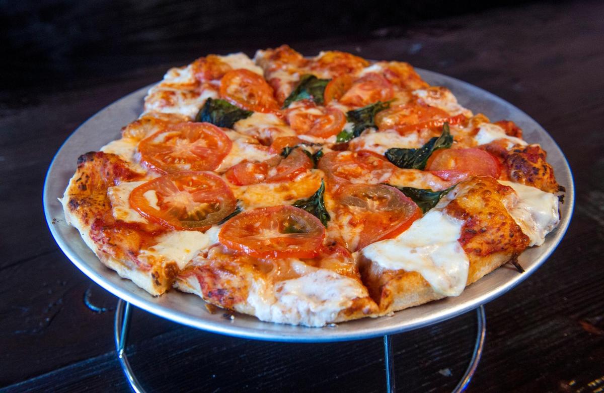 Six 12-inch pizzas are on the menu at Parky’s, including a Margherita made with fresh tomatoes, basil and mozzarella. Photo taken in Tacoma on Wednesday, Sept. 1, 2021.