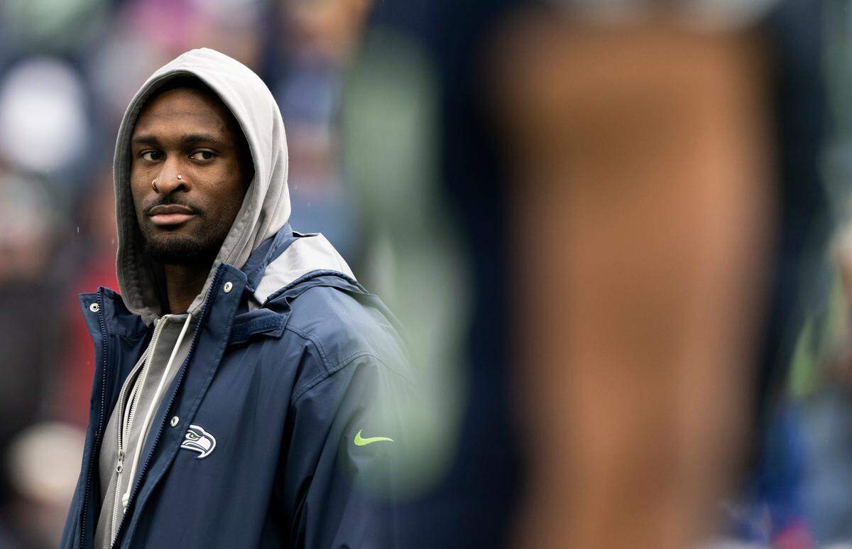 Seattle Seahawks wide receiver DK Metcalf (14) looks on as teammates warm up before the game against the Buffalo Bills at Lumen Field, on Sunday, Oct. 27, 2024 in Seattle, Wash.