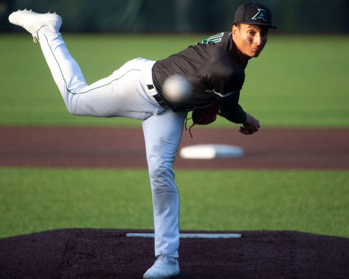 Auburn starter Amari Goodfellow delivers a pitch to a Peninsula batter during the bottom of the third inning of the 3A District 3/4 championship game on Saturday, May 14, 2022, at Auburn High School in Auburn, Wash.