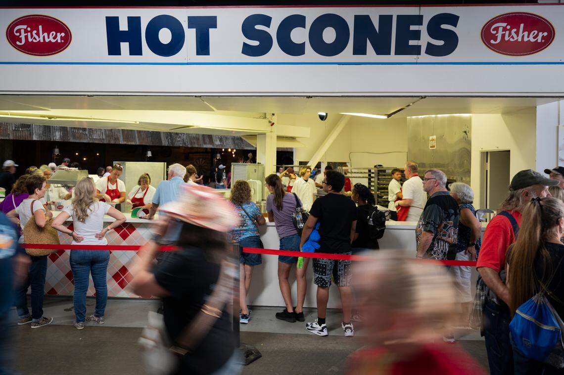 People wait in line for Fisher’s scones during the opening day of the Washington State Fair in 2024.
