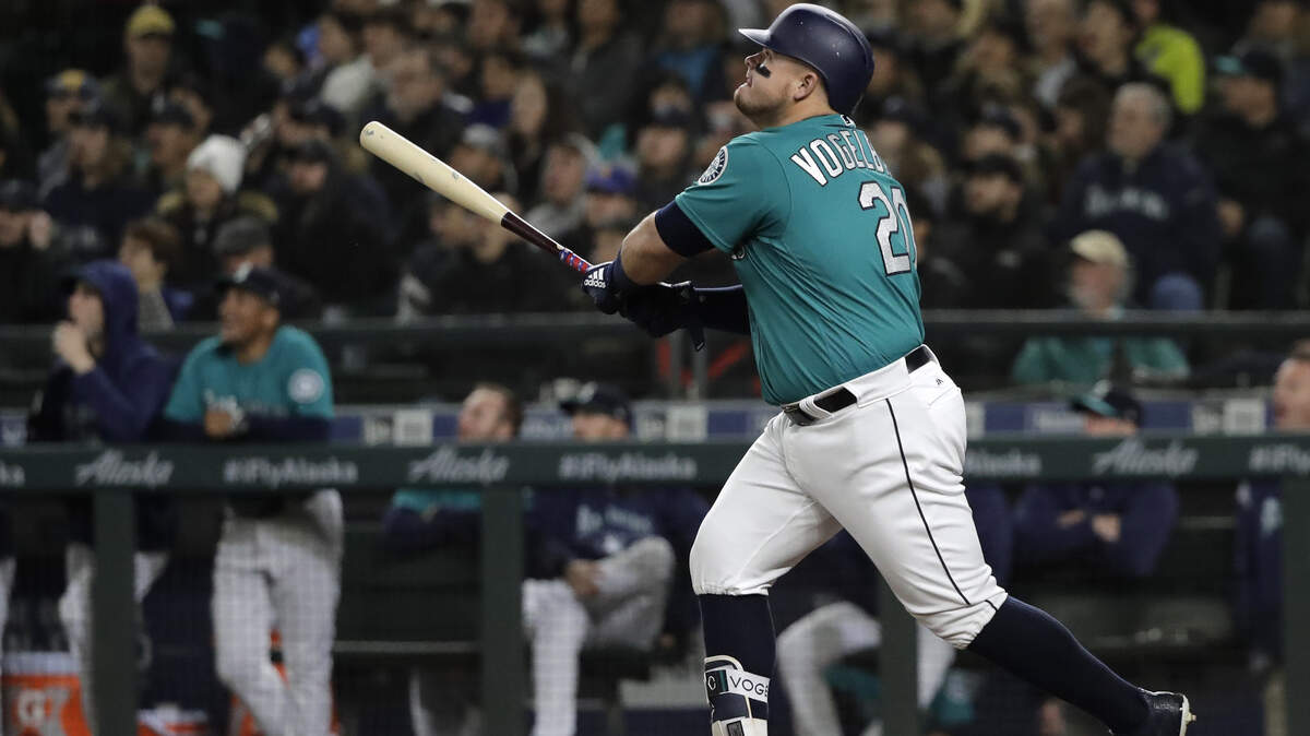 Seattle Mariners’ Daniel Vogelbach watches his two-run home run against the Oakland Athletics during the seventh inning of a baseball game, Friday, April 13, 2018, in Seattle. Seattle won 7-4. (AP Photo/Ted S. Warren)