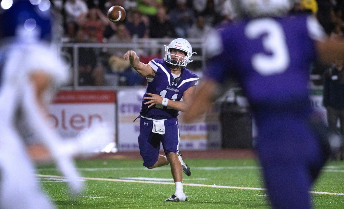 Sumner quarterback Tristen Rebar fires a touchdown pass to wide receiver Braylon Pope (3) during Friday night’s football game against the Curtis Vikings at Sunset Chevy Stadium in Sumner, Washington, on Sept. 8, 2023. Curtis won the game, 38-33.