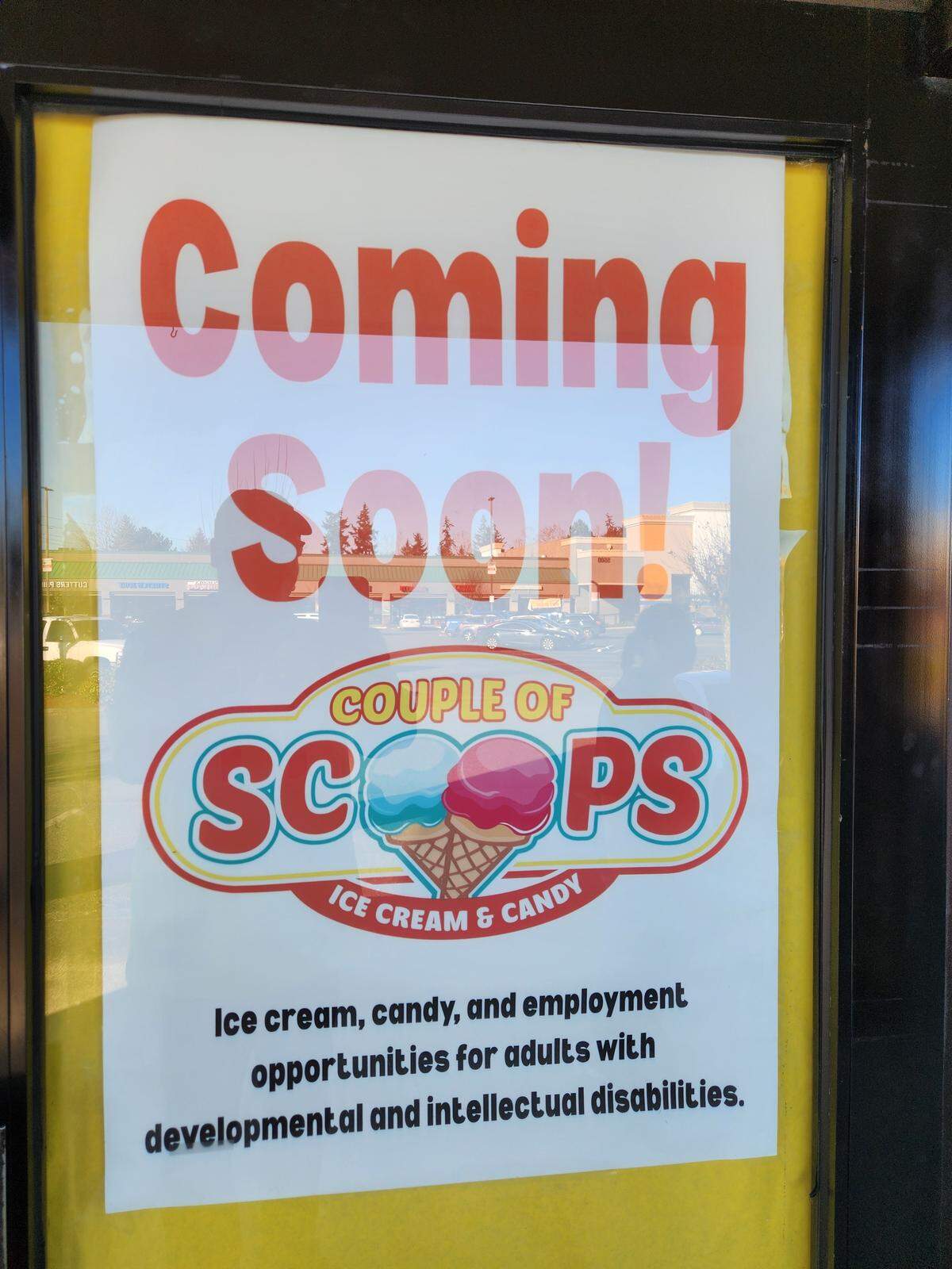 A ‘Coming Soon’ sign marks the exterior of the future Couple of Scoops location at 5500 Olympic Dr. NW, Suite H-103 in Gig Harbor, Wash. The store expects to open May 1, 2026.