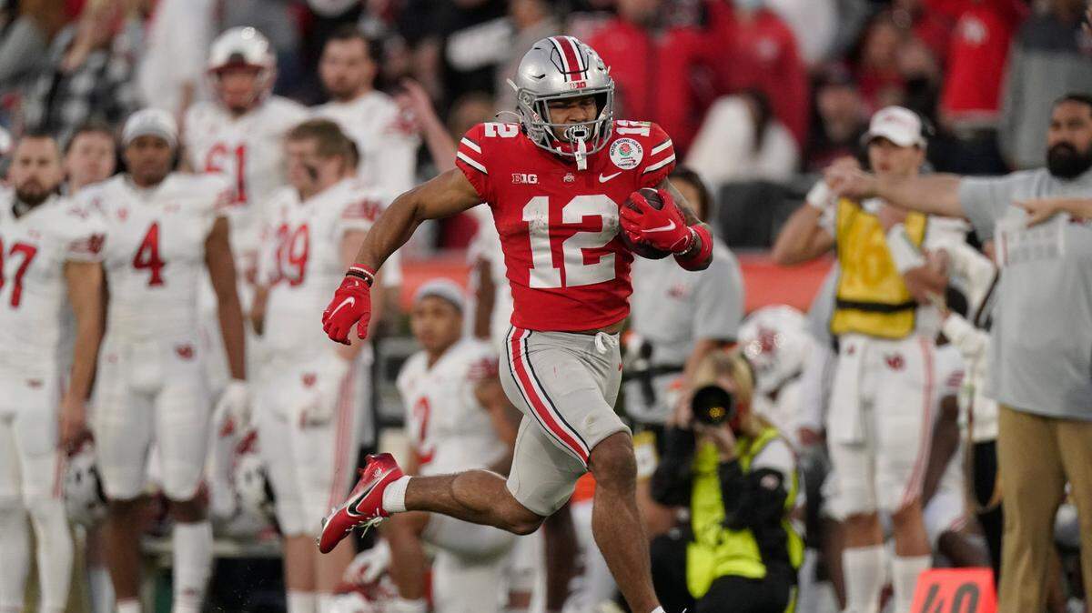 Ohio State wide receiver Emeka Egbuka (12) runs during the second half in the Rose Bowl NCAA college football game against Utah Saturday, Jan. 1, 2022, in Pasadena, Calif. (AP Photo/Mark J. Terrill)