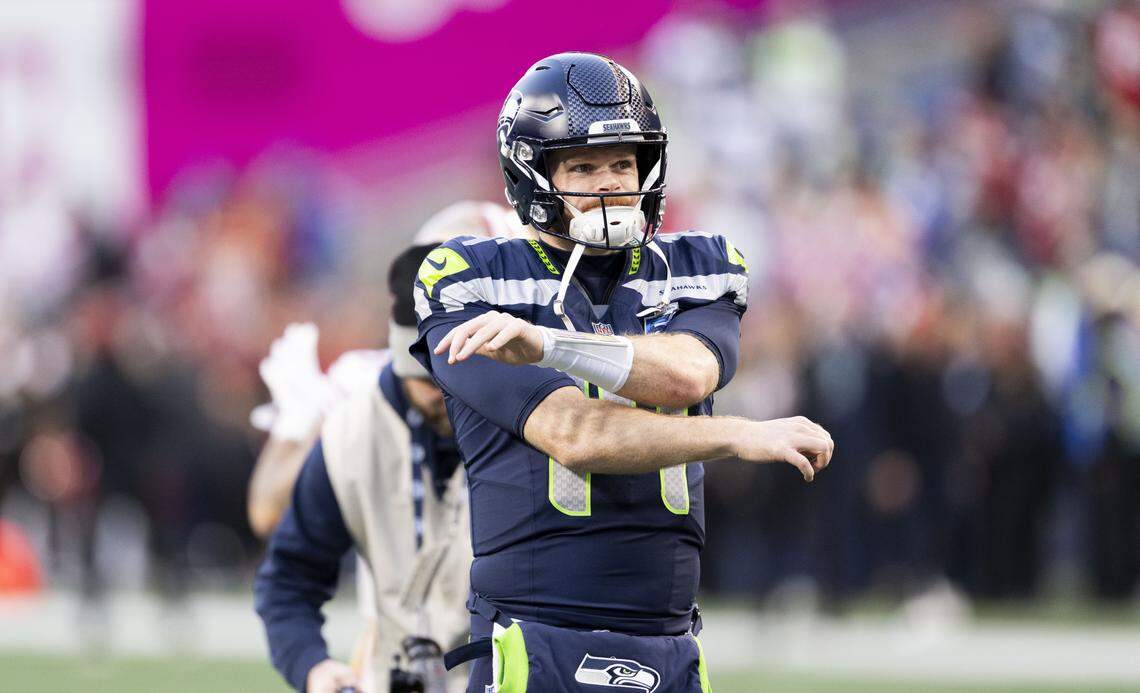 Seattle Seahawks quarterback Sam Darnold (14) stretches before the NFC Divisional Round game against the San Francisco 49ers at Lumen Field, on Saturday, Jan. 17, 2026, in Seattle.