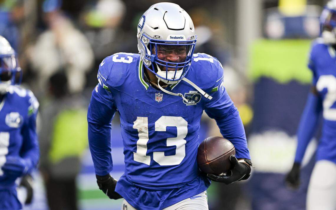 Seattle Seahawks linebacker Ernest Jones IV (13) reacts to his second interception thrown by Minnesota Vikings quarterback Max Brosmer (12) during the fourth quarter of the game at Lumen Field, on Sunday, Nov. 30, 2025, in Seattle.