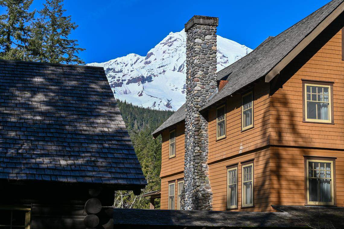Mount Rainier peeking out from behind The National Park Inn at Longmire village.