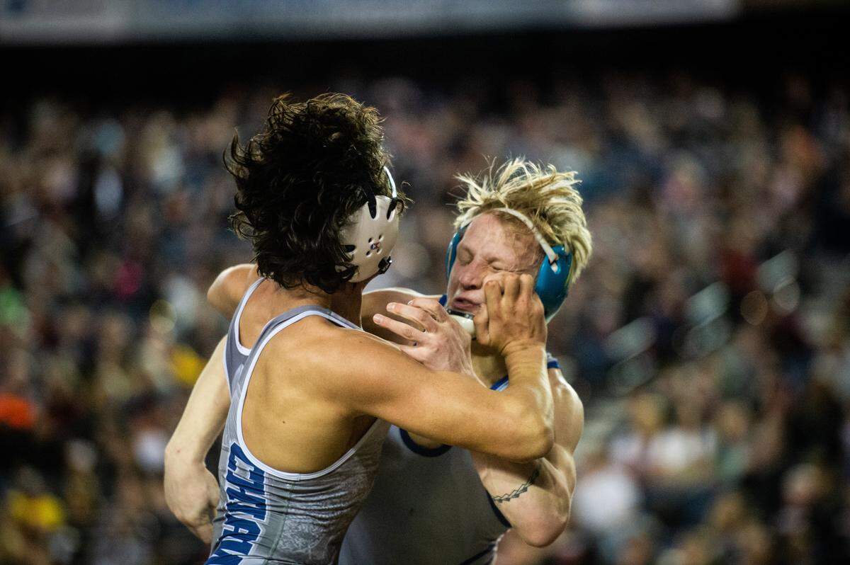 Curtis’ Ryan Wheeler wrestles Darion Johnson in the 4A 152 pound championship during day two of Mat Classic XXXII at the Tacoma Dome in Tacoma, Wash., on Saturday, Feb. 22, 2020.