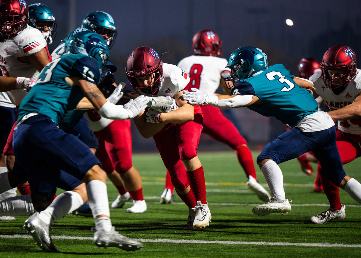 Kennedy Catholic running back Indy Jones (5) tries to charge into the end zone to score a touchdown as Auburn Riverside linebacker Alex Park (3) tries to defend in the second quarter of a game at Auburn Memorial Stadium in Auburn, Wash. on Oct. 6, 2022. Kennedy Catholic defeated Auburn Riverside 47-17.