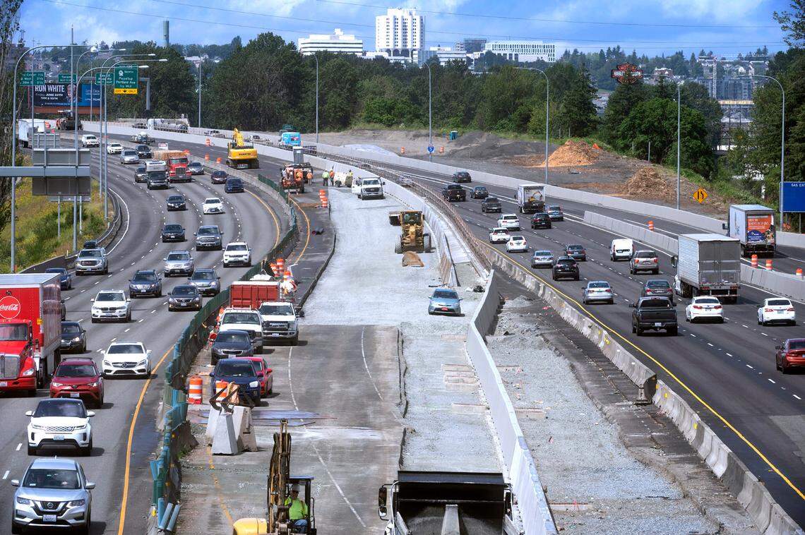 Traffic flows past the construction work on the new High Occupancy Vehicle (OHV) lanes on Interstate 5 in Tacoma, Washington on Thursday, June 16, 2022.