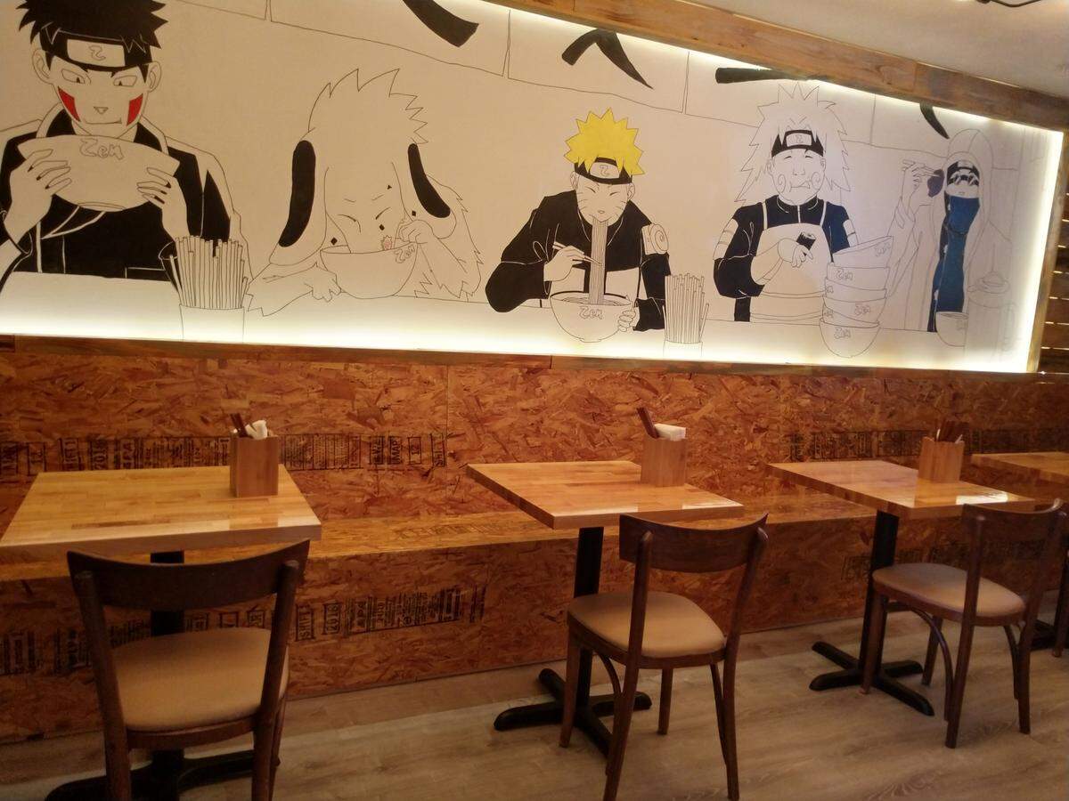 A mural spans the dining room wall at Zen Ramen & Sushi Burrito.